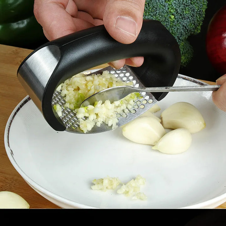 Stainless steel garlic press.