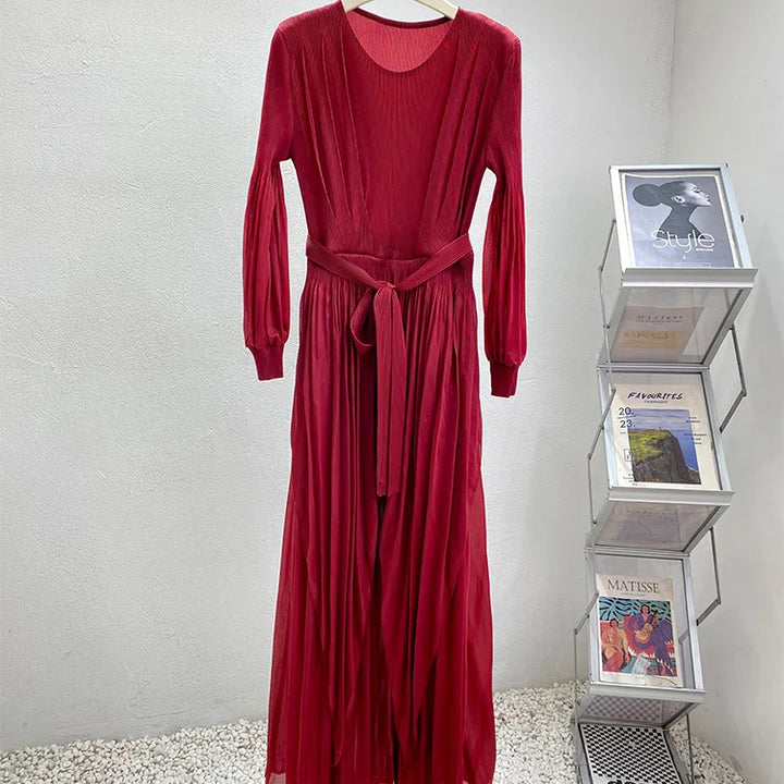 Irregular pleated long dress with belt.