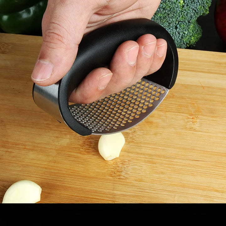 Stainless steel garlic press.