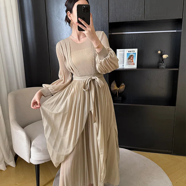 Irregular pleated long dress with belt.