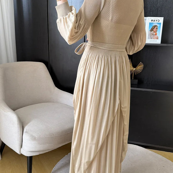 Irregular pleated long dress with belt.