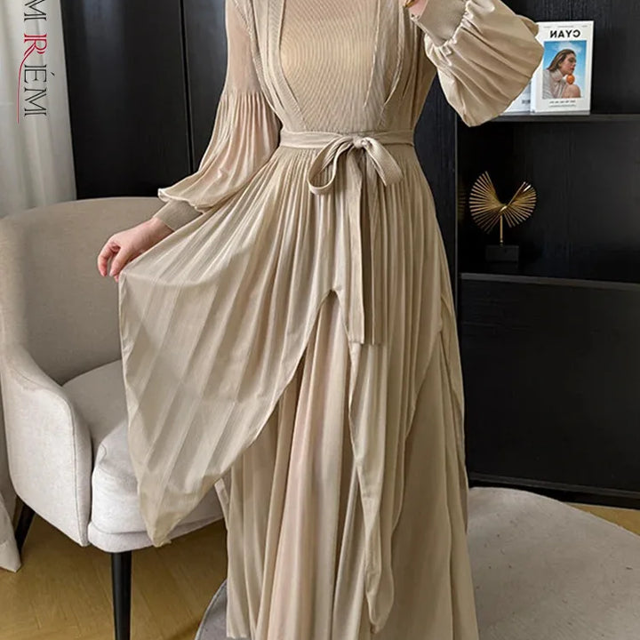 Irregular pleated long dress with belt.