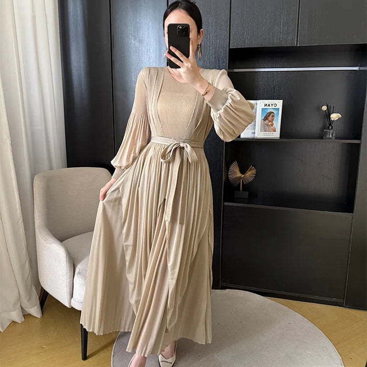 Irregular pleated long dress with belt.