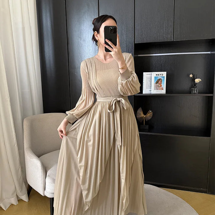 Irregular pleated long dress with belt.